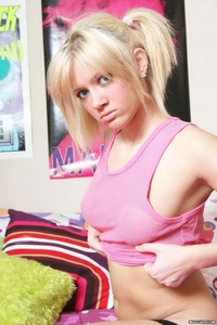 Teenie blonde gets naked on her bed