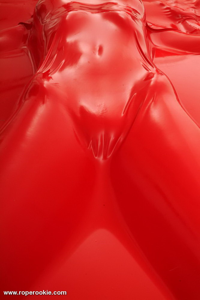 Blond babe is bound in air tight latex