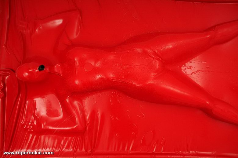 Blond babe is bound in air tight latex