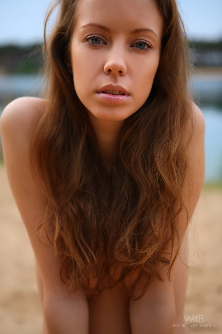 Natasha is naked on the beach