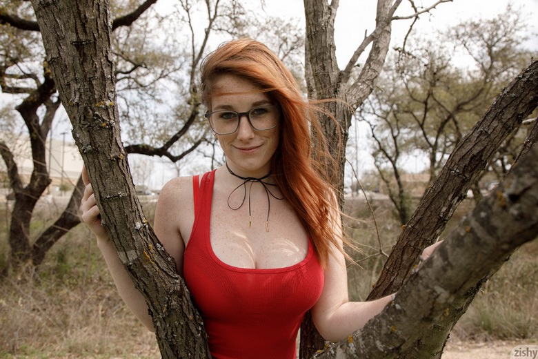 Busty redhead is reading