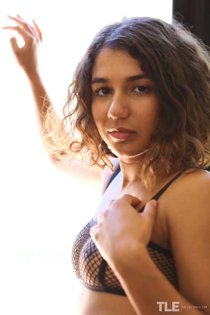 Rubi displays her kinky fishnet lingerie